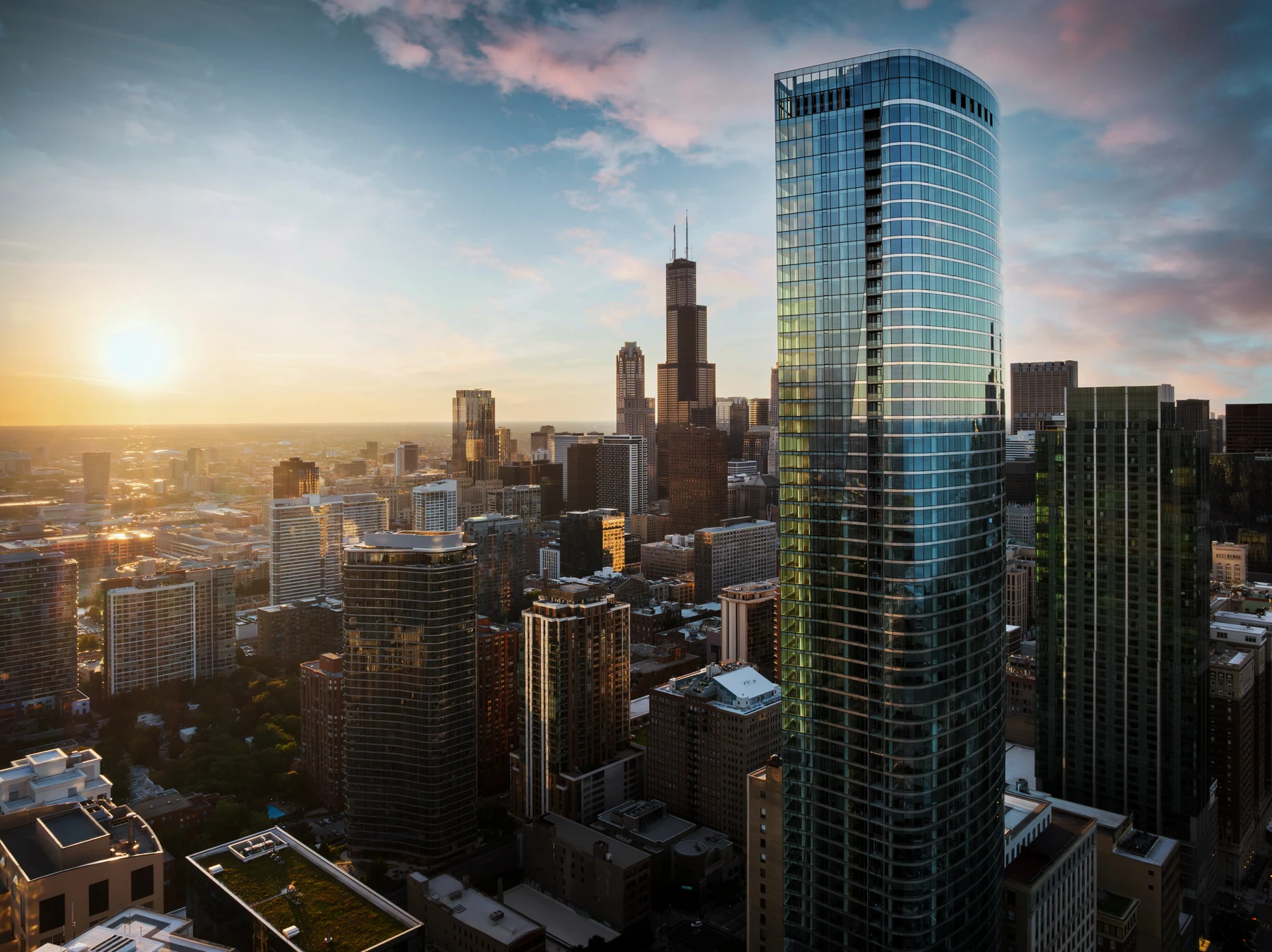 Drone view of 1000M and the Chicago skyline at sunset